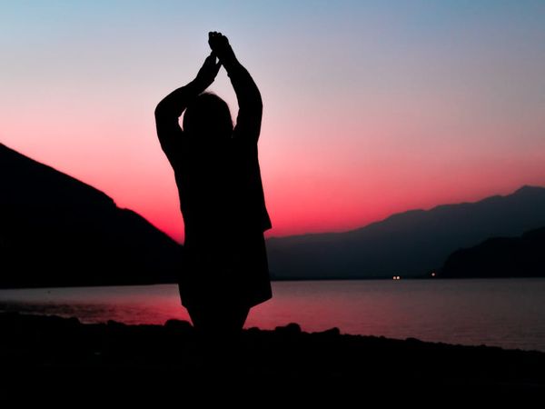 Serene landscape with mountains and calm water reflecting balance.